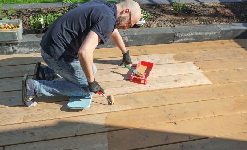 How Size and Material Affect Deck Staining Prices