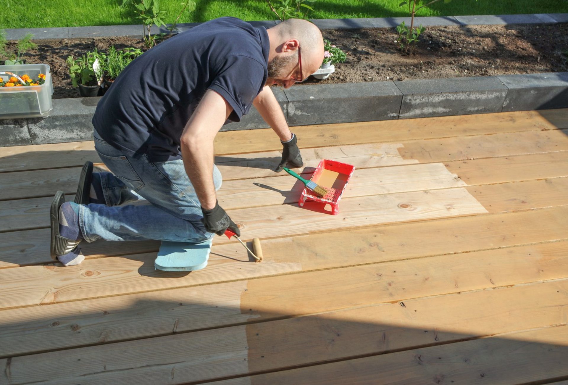 How Size and Material Affect Deck Staining Prices